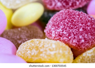 Colorful candies. Isolated on wooden background. Colorful candies in white dish.A lot of colorful candy.Colorful candies 2K19.