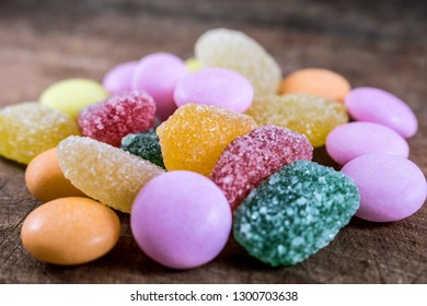Colorful candies. Isolated on wooden background. Colorful candies in white dish.A lot of colorful candy.Colorful candies 2K19.