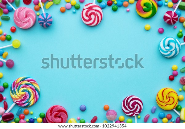 Colorful Candies On Blue Background Stock Photo (Edit Now) 1022941354