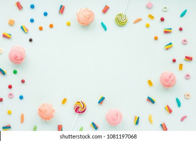 Colorful candies on pastel turquoise background. Flat lay, top view - Shutterstock ID 1081197068