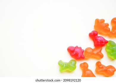 Colorful Candies On White Background With Copy Space. Sticky Candy Damage Your Child's Teeth. The Biggest Problem Is Having The Candy Get Stuck In Between The Teeth.