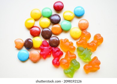 Colorful Candies On White Background With Copy Space. Sticky Candy Damage Your Child's Teeth. The Biggest Problem Is Having The Candy Get Stuck In Between The Teeth.