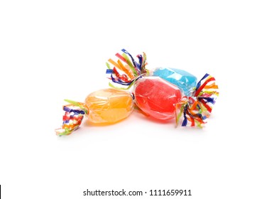 Colorful candies with transparent cellophane wrapping isolated on white background  - Shutterstock ID 1111659911
