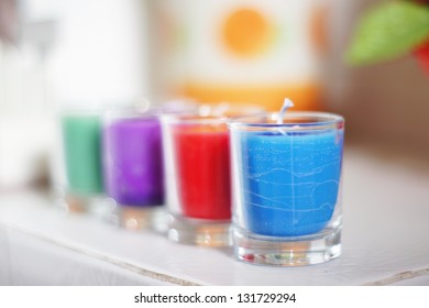 Colorful candle in a glass beaker , Soft focused with blurry background