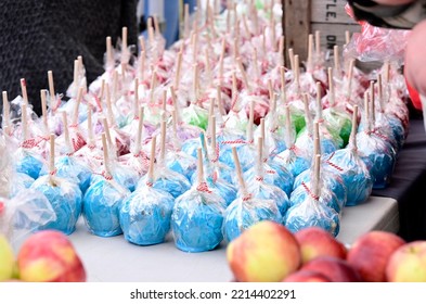 Colorful Candy Apples On A Table At A Small Town Apple Festival