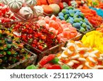 Colorful candy assortment at market in Barcelona, Spain, sweets shop stall, candy store, fruit jelly candies