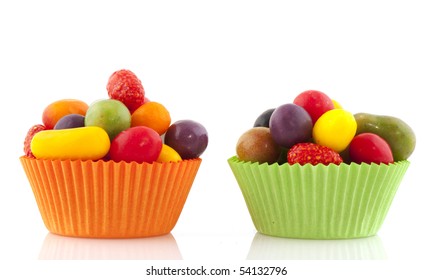 Colorful Candy In Fruit Shape With Orange And Green Cup Cake Papers