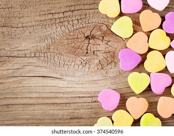 Colorful Candy Hearts On Wooden Background