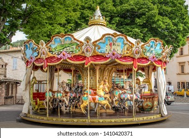 Colorful Carousel Attraction Ride With Wooden Horses in an Italian Village