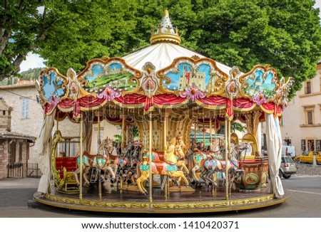 Colorful Carousel Attraction Ride With Wooden Horses in an Italian Village