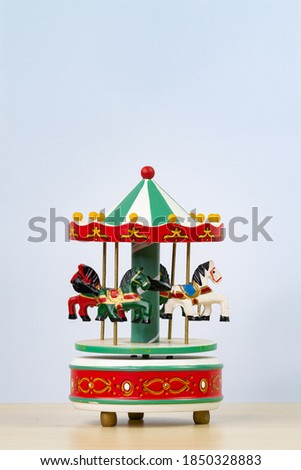 colorful carousel toy in white background. Vertical