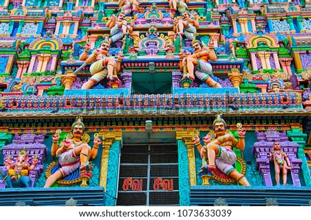 Colorful carved idols on the Gopuram of Nataraja Temple. Hindu temple dedicated to Nataraja Shiva as lord of dance. Temple wall carvings display all 108 karanas from the Natya Shastra by Bharata Muni
