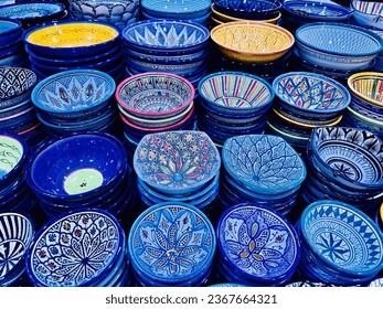 Colorful ceramic plates. Moroccan pottery and ceramics in Souk El Had Agadir.