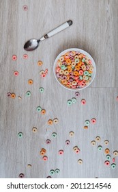 Colorful Cereal  In A Bowl With Spoon On The Floor.