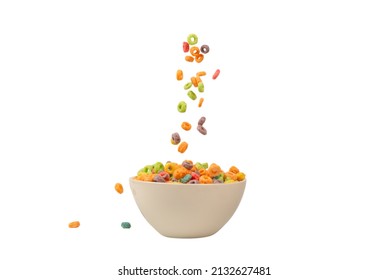 Colorful cereal box for morning breakfast. Corn flakes falling to the white bowl. Motion. Copyspace.