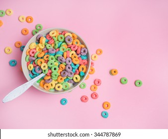 Colorful cereal in white bowl with shoon on a white background - Powered by Shutterstock