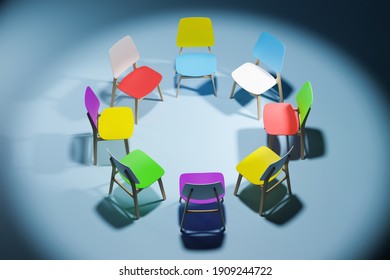 Colorful Chairs In A Circle In An Empty Dark Studio Room. The Concept Of Communication.