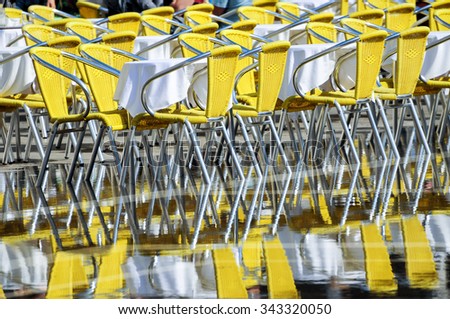 Colorful Chairs Reflected On Water That Stock Photo Edit