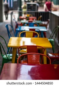 Colorful chairs and tables on restaurant patio