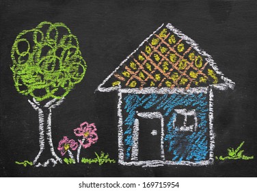 Colorful chalk illustration of home by kid on blackboard  - Powered by Shutterstock