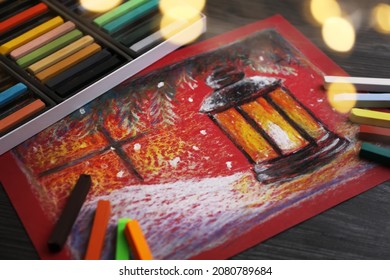 Colorful chalk pastels   beautiful painting black wooden table  Bokeh effect