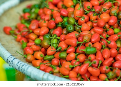 colorful chilli peppers on wooden table from above,tabasco pepper