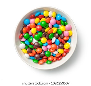 Colorful Chocolate Candy Pills In Bowl Isolated On White Background. Top View