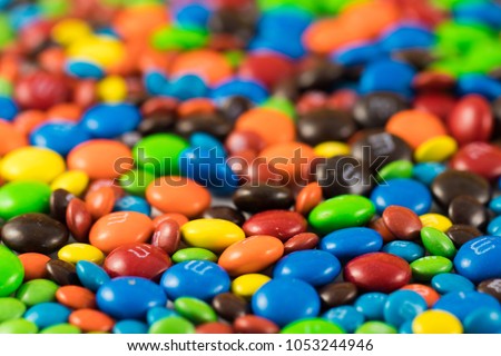 Colorful chocolate M&Ms in and out of focus