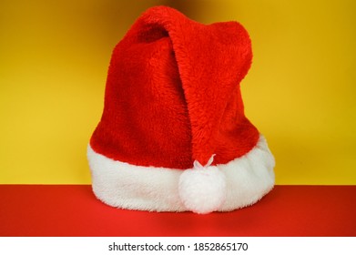 Colorful Christmas Background With Santa Hat. Side View.