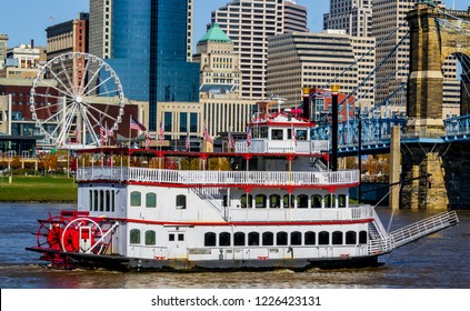 Colorful Cincinnati river front looking from Kentucky with steam boat and Farris wheel. Urban exploration photography 2018