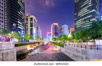 Colorful city lights of Cheonggyecheon Stream Park with Crowd at night in Seoul City, South Korea.