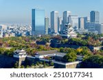 Colorful cityscape of Osaka city and Osaka castle in autumn season with clear blue sky background, Japan. Top view. Landmark of Osaka.