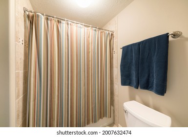 Colorful Closed Shower Curtain In A Windowless Bathroom