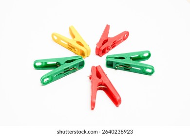 Colorful Clothespins Arranged in Circle on White Background