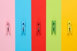 Lot Of Colorful Clothespins On Colored Background