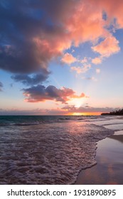 Colorful Clouds In Sunrise Sky Over Atlantic Ocean Coast, Bavaro Beach, Punta Cana. Dominican Republic. Vertical Photo Background