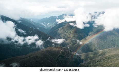 Colorful Cloudy Landscape With A Rainbow Above The Amazon Rainforest In Peru.