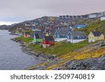 Colorful coastal houses in Nuuk Greenland under grey skies