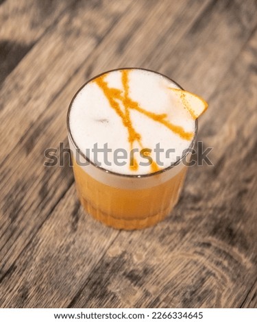 Colorful cocktail with garnish in bar