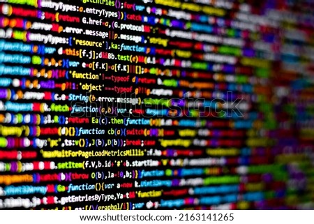 Colorful code background. compressed javascript code on computer screen. Software developer coding screen