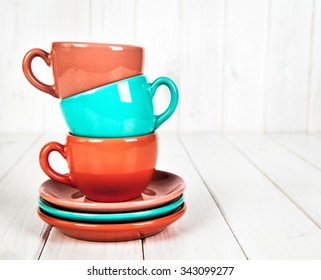 colorful coffee cups on white wooden background ez canvas