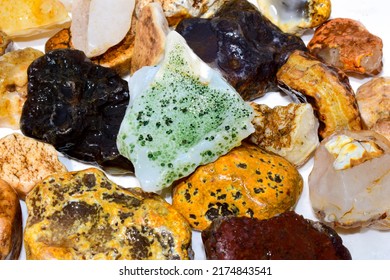Colorful collection of small river stones on white background, River stones background. - Shutterstock ID 2174843541