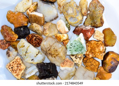 Colorful collection of small river stones on white background, River stones background. - Shutterstock ID 2174843549