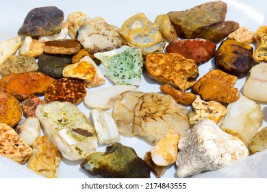 Colorful collection of small river stones on white background, River stones background. - Shutterstock ID 2174843555