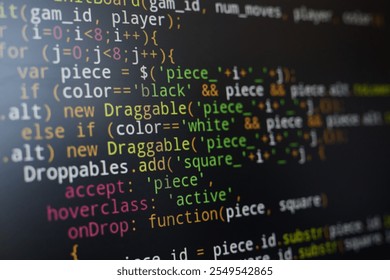 Colorful and complex JavaScript code displayed on a computer screen, highlighting various syntax elements. Focus on programming details and coding structure - Powered by Shutterstock