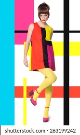 Colorful Concept In Sixties Retro Fashion Style With Caucasian Model Posing Full Body Over Designed Background With Colorful Bright Stripes And Color Blocks.