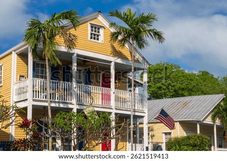 Colorful Conch house with a tropical backyard, vibrant colors architecture in Bahama village, Key West, Florida