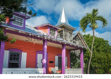 Colorful Conch house with a tropical backyard, vibrant colors architecture in Bahama village, Key West, Florida
