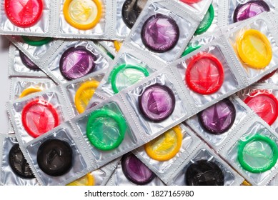 Colorful condoms background. Top view. 