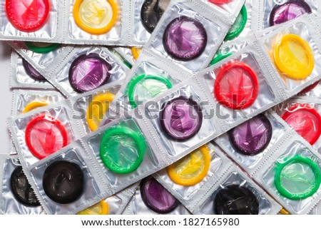 Colorful condoms background. Top view. 